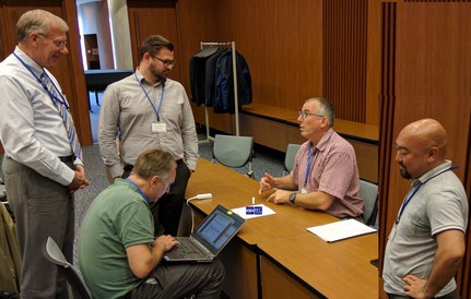 The picture shows from left Dick Fischer (USA), Rainer Schrundner (ident.one, Germany), Steyn Geldenhuis (South Africa), project editor Bertus Pretorius (Australia), Ehara Masaki (Japan) discussing features of the standard at the ISO SC31 meeting in Sapporo.